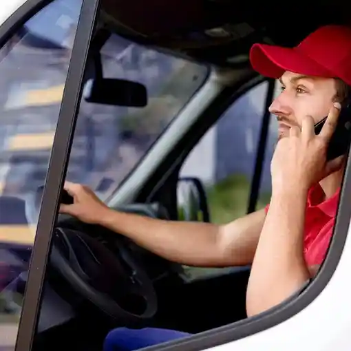 Proget mobility management for transport and logistics, truck driver talks on phone