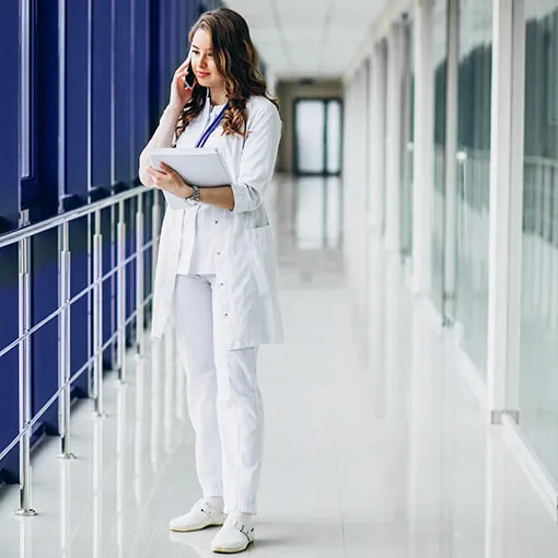 Proget mobility management for the medical industry: doctor holds records and talks on the phone