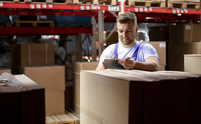 warehouse worker with a tablet